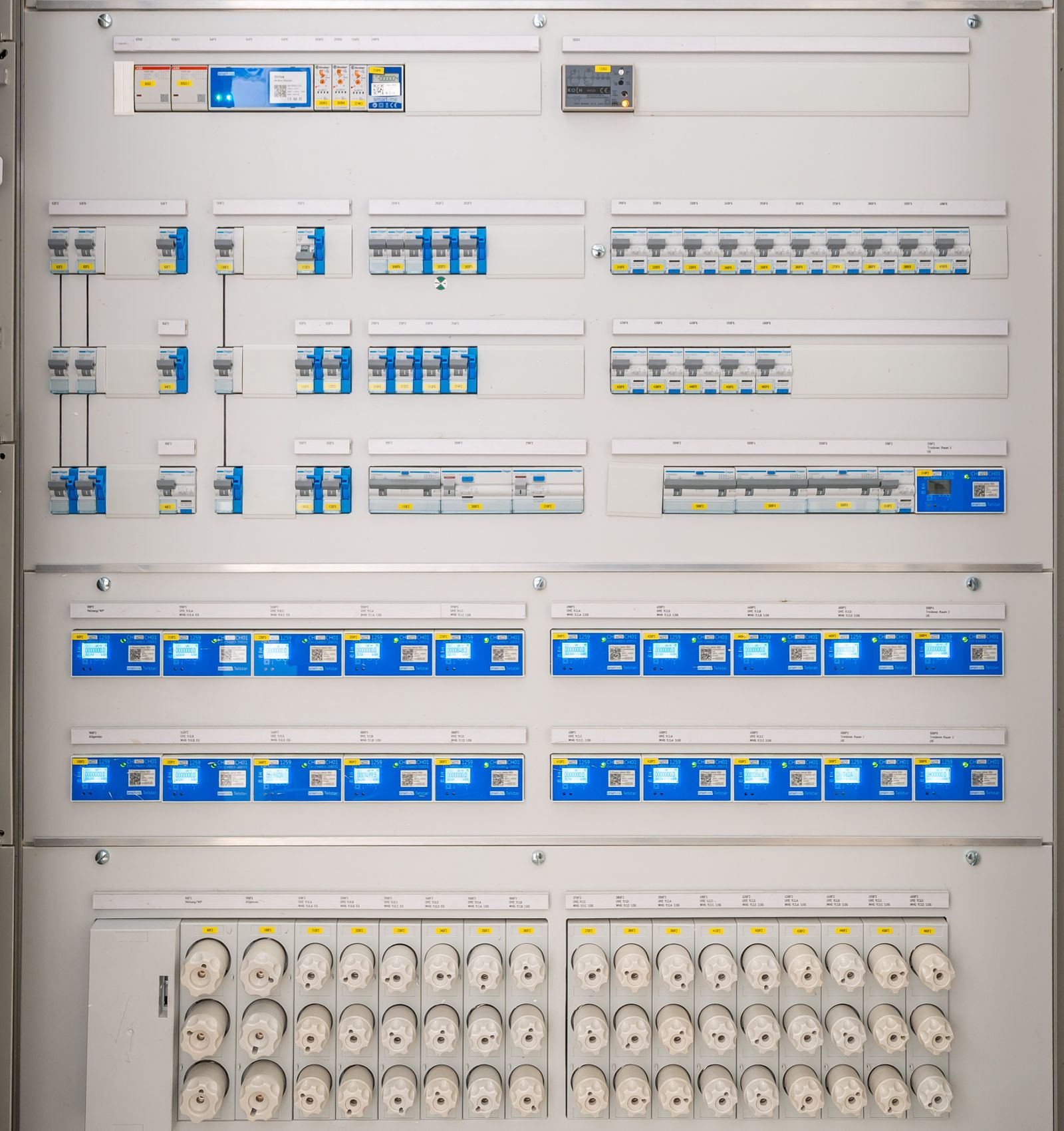 Electrical distribution cabinet with breakers and meters (stock photograph).